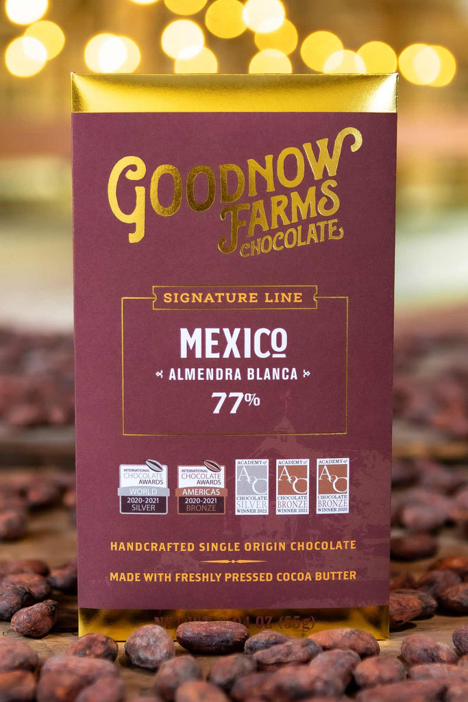 Mexico, Almendra Blanca 77% on a table with cocoa beans