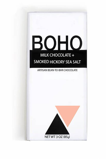 The front of a wrapped Milk Chocolate + Smoked Hickory Sea Salt Bar from BOHO Chocolate, with a white background.