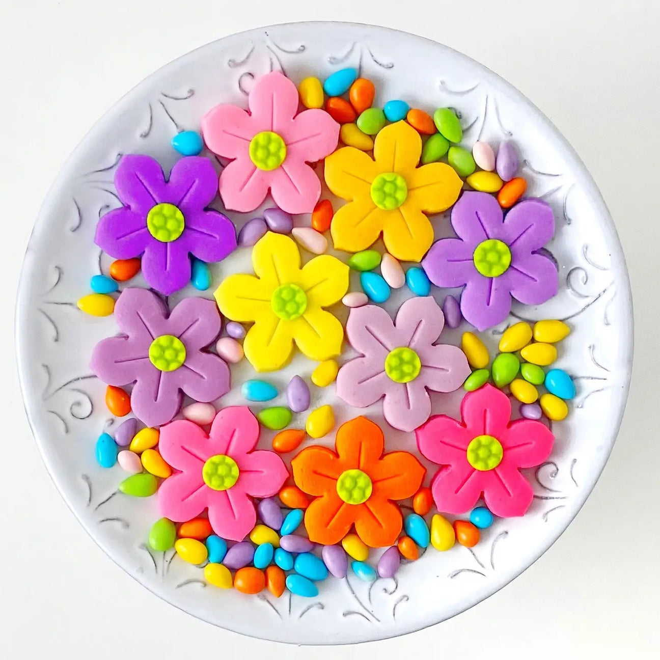 Marzipan Easter & Mother's Day Flowers on a plate against a white background
