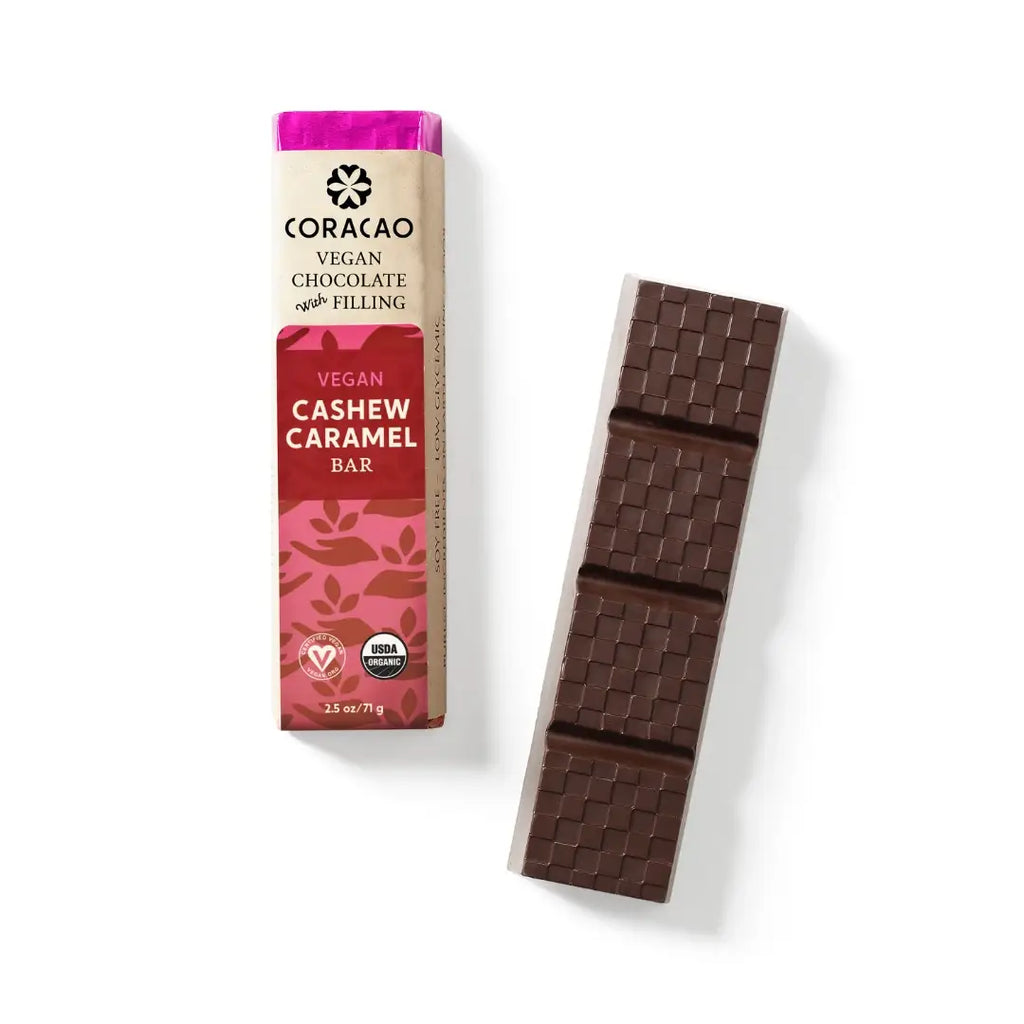 A wrapped Vegan Caramel Filled Dark Chocolate Bar bar to the left of an unwrapped Vegan Caramel Filled Dark Chocolate Bar, against a white background.