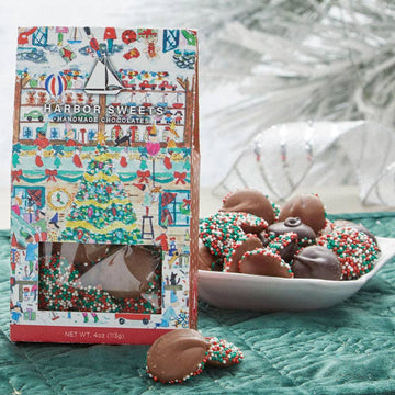 Nonpareils on a blue table with Christmas decor