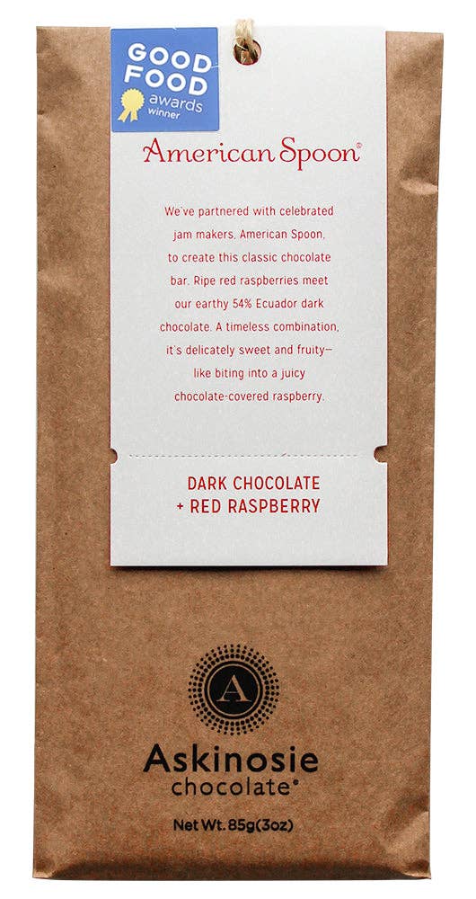 The front of a wrapped Dark Chocolate + Red Raspberry Bar from Askinosie Chocolate.