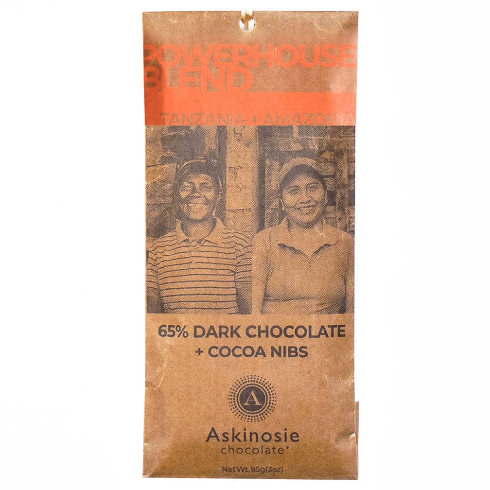 The front of a wrapped 65% Powerhouse Blend Nibble Bar Brazil & Tanzania from Askinosie Chocolate, with a white background.