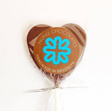 Heart Shaped Lollie 53% Dark against a white background