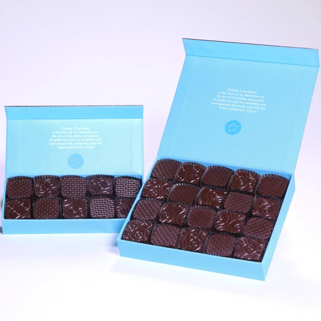 Two boxes of Fleur de Sel Caramels against a tinted background