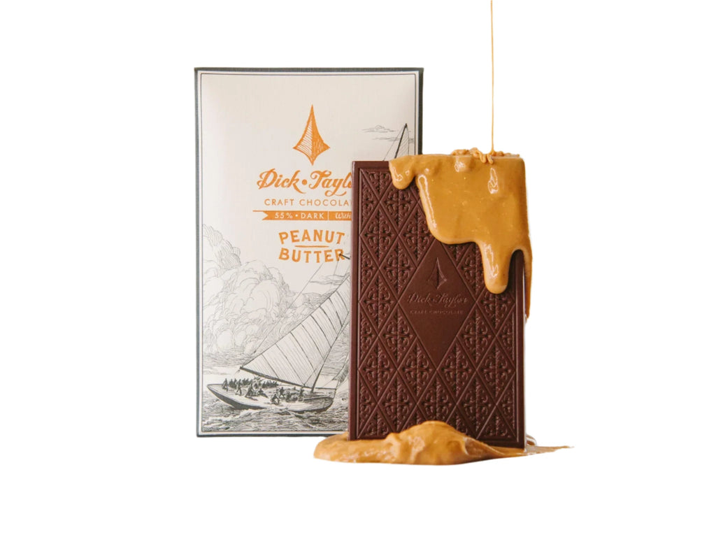 A wrapped and unwrapped Peanut Butter bar from Dick Taylor on a white background