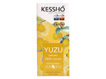 The front of a KESSHO wrapped Yuzu 56% Dark Milk back against a white background