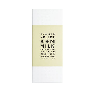 The front of a wrapped K+M Golden Milk 50% bar against a white background