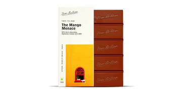 The front of a wrapped "The Mango Menace - 55% Dark Alphonso Mango Chilli Chocolate" bar to the left of an unwrapped "The Mango Menace - 55% Dark Alphonso Mango Chilli Chocolate" bar, with a white background. 