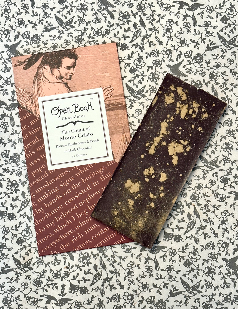 The Count of Monte Cristo chocolate bar on a table with florals and birds