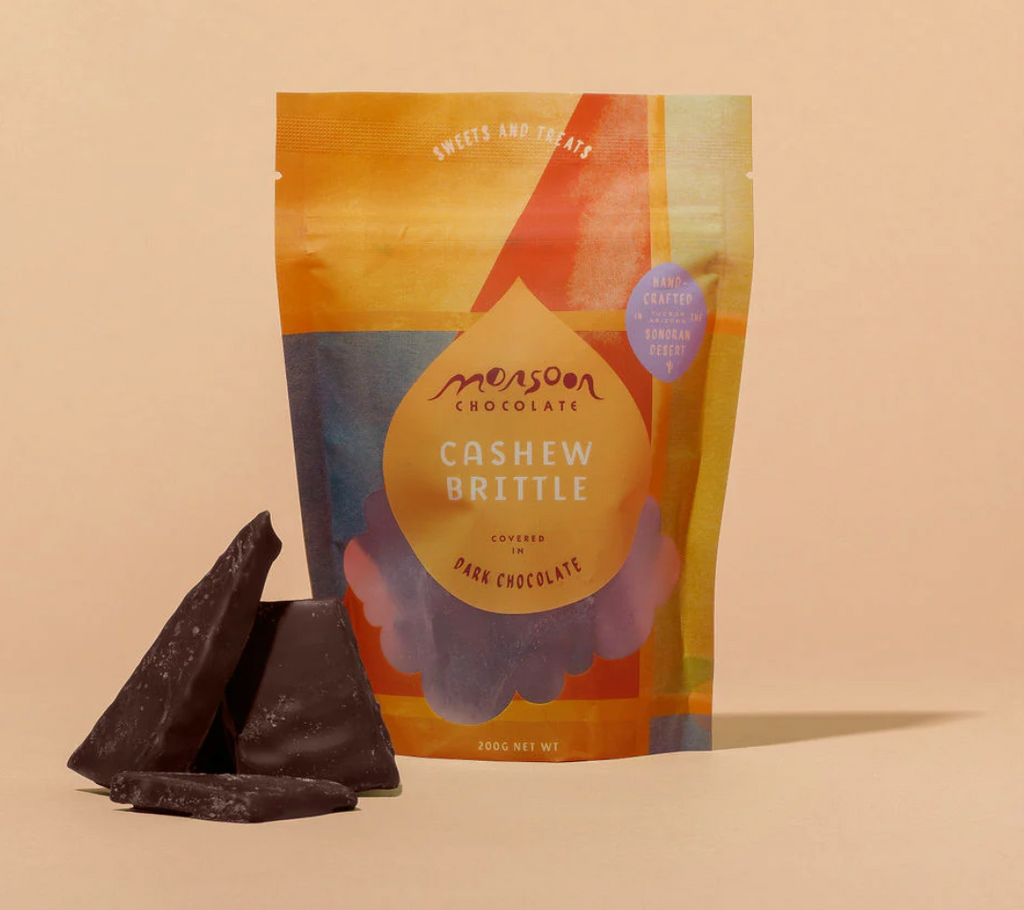 Monsoon Chocolate Cashew Brittle from Monsoon Chocolate against an orange background