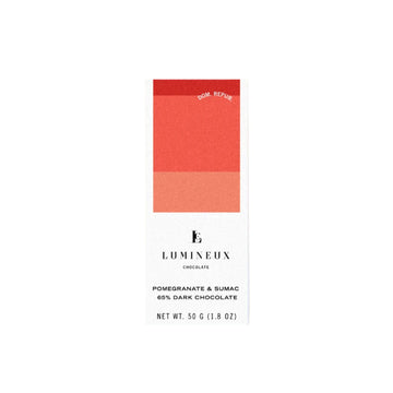 Lumineux Pomegranate & Sumac 65% Dark Chocolate bar against a white background
